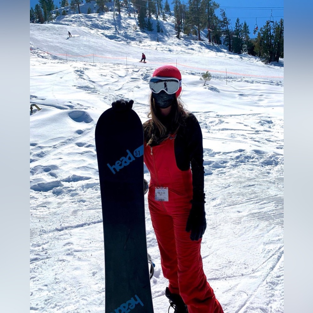 Red bib ski jumpsuit
